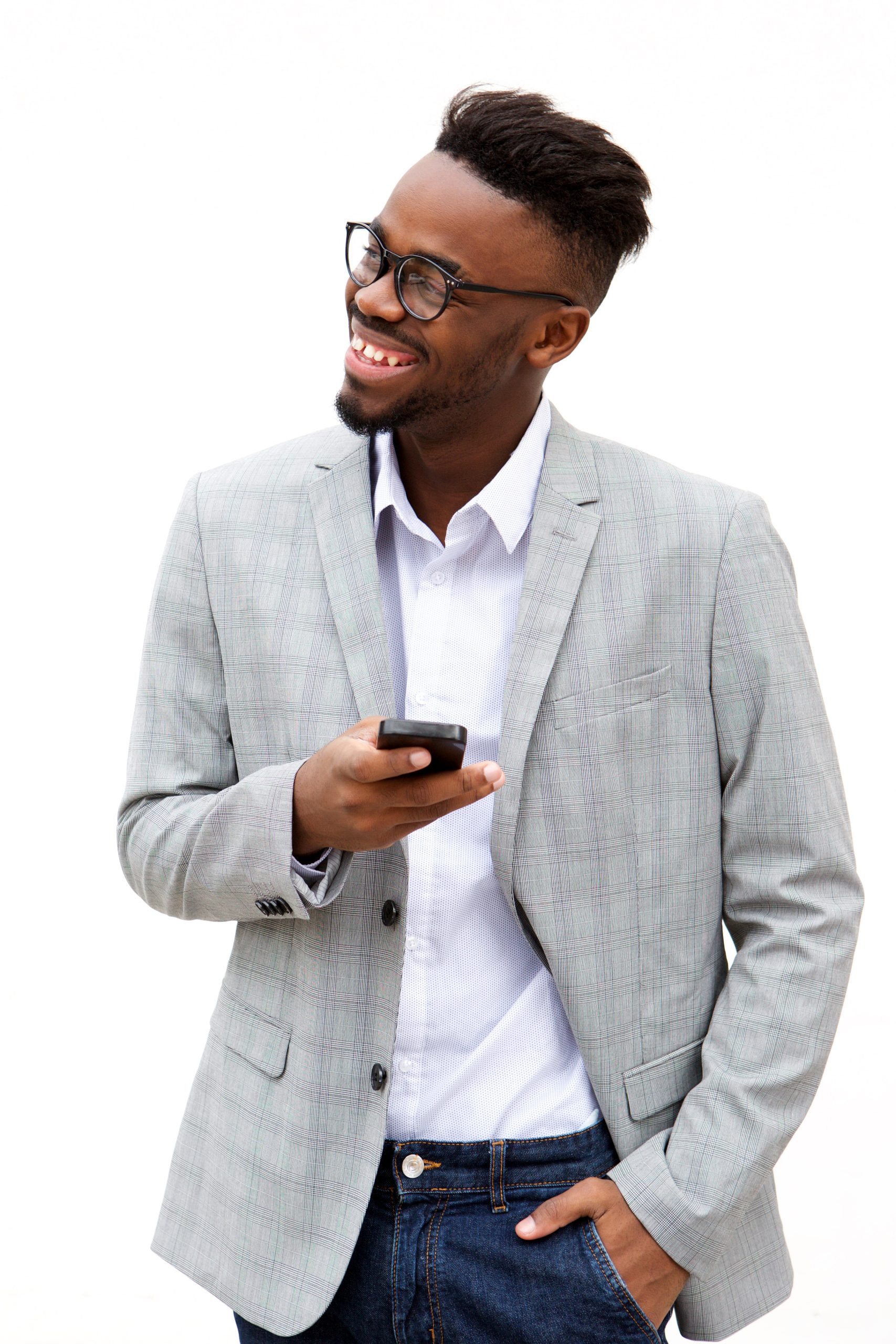 young businessman with mobile phone smiling against white background